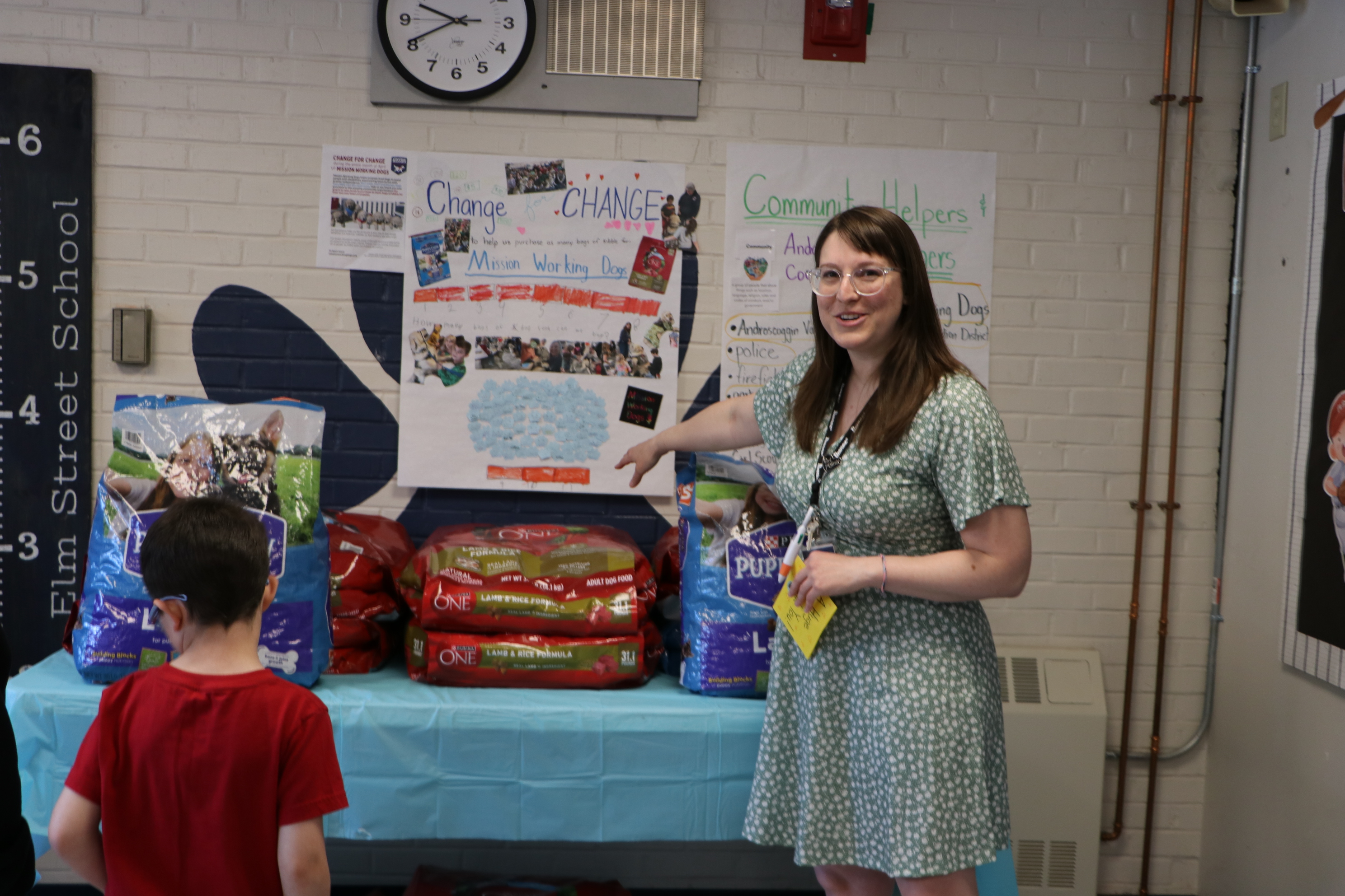 Second-grade teacher Jessica Harvey discusses the donation during a recent school event.