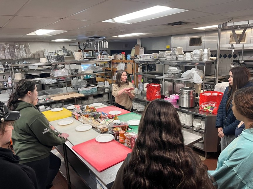 While at Migis Lodge in Casco, students created their own charcuterie boards while learning about presentation, pricing, and profit. By applying math skills, they calculated that each board would need to sell for $20 to turn a profit. This hands-on adventure was led by the owner of Ironclad Eats Food Truck based out of Windham. 