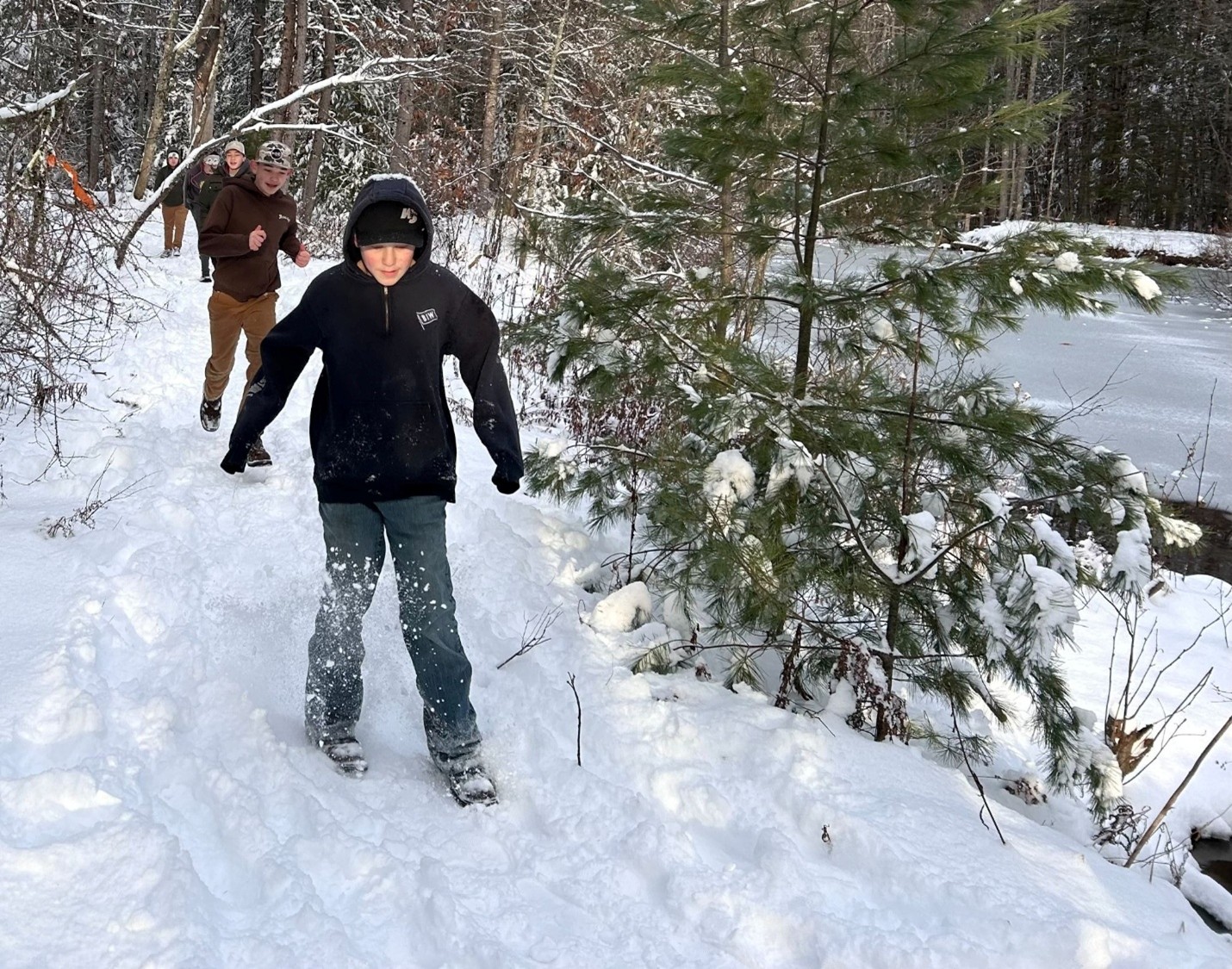 Sheepscot students on a pond loop walk following a fresh snow.