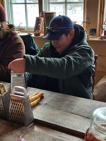 An ALP student gains hands-on experience in the kitchen, learning how to create nutritious homemade meals as part of everyday learning.