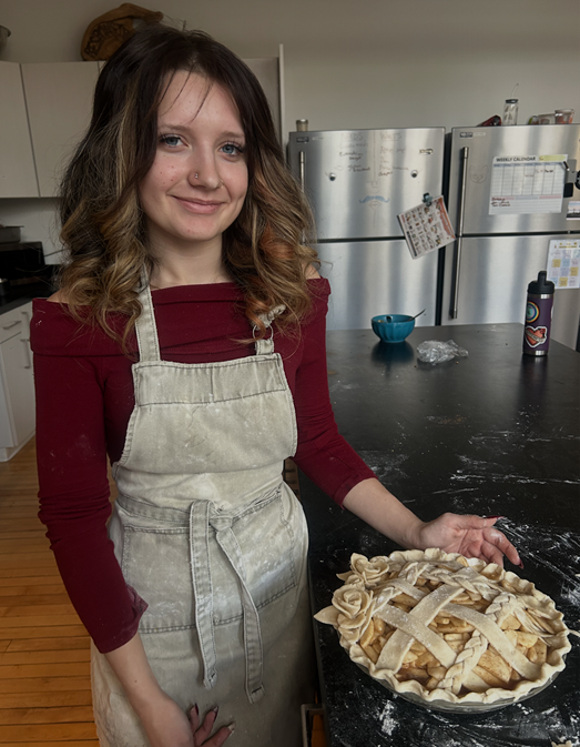 A senior in the Zenith Alternative Education Program shows off her latticed apple pie.