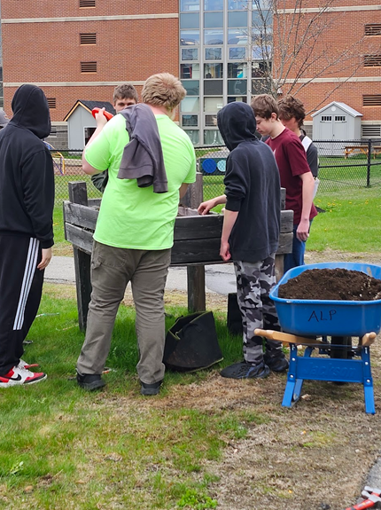 Freshmen ALP students nurture both plants and knowledge as they learn about plant growth and care for the greenhouse, an important component of the ALP experience.