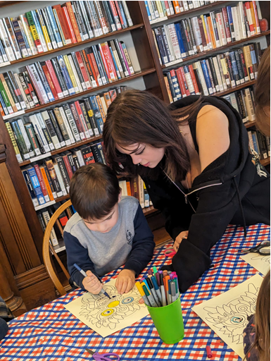 A REACH School student volunteers at the library as part of the program’s weekly community service opportunities.