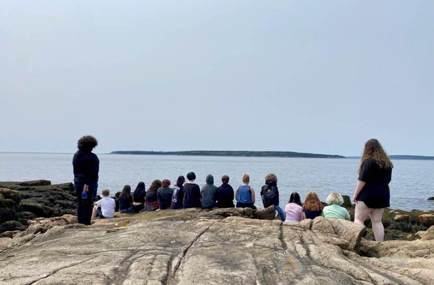 A group of Innovations students enjoys the coast of Maine at Ship Harbor Trail in Bass Harbor.