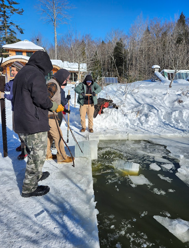 ALP students explore winter ecology by learning about ice fishing, ice layers, and how seasonal climate conditions shape the frozen landscape.