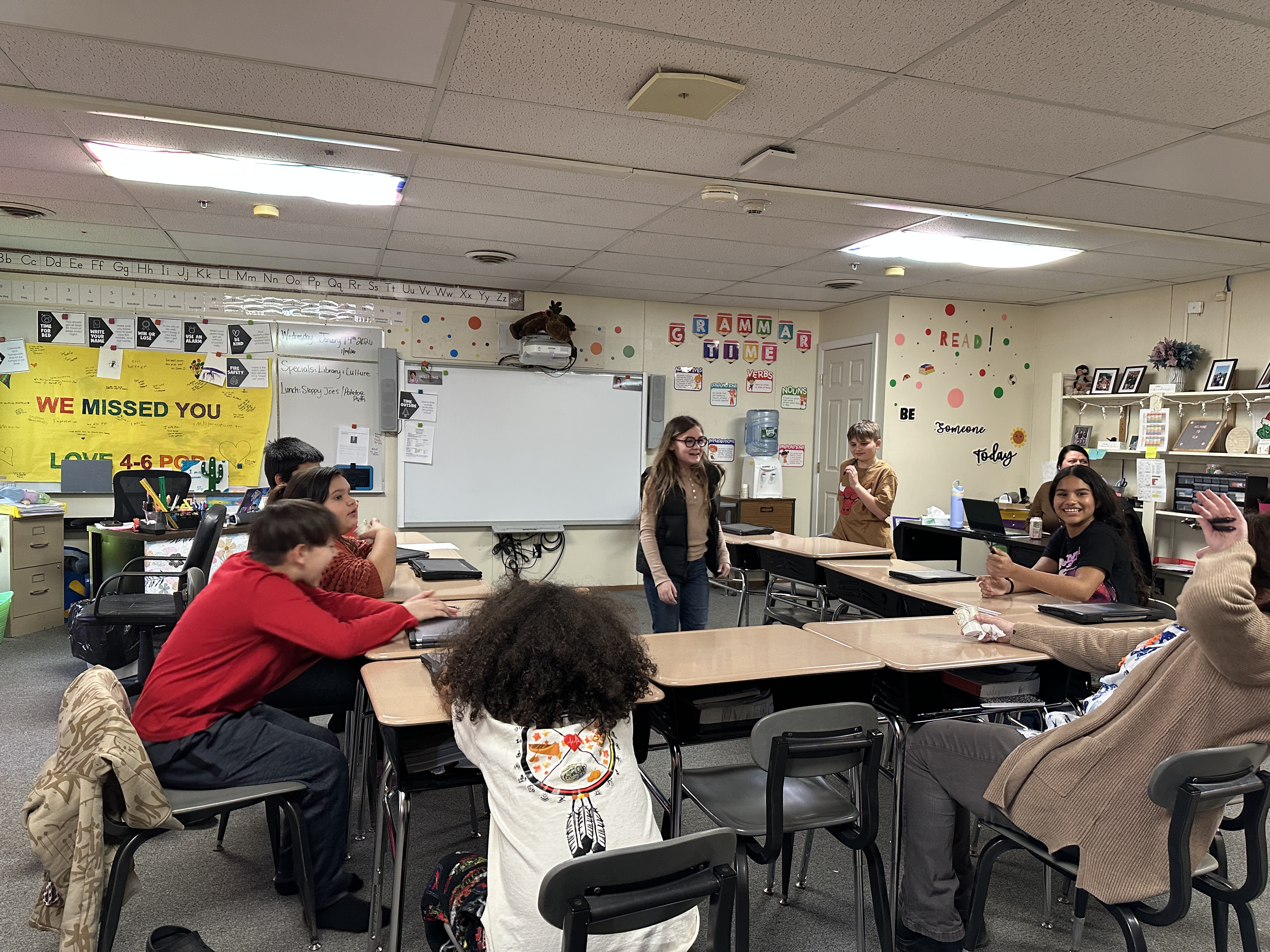 Students play a charades game focused on identifying emotions as part of their “I-Time” BARR activities. As one student acts out a feeling, others work together to interpret it.