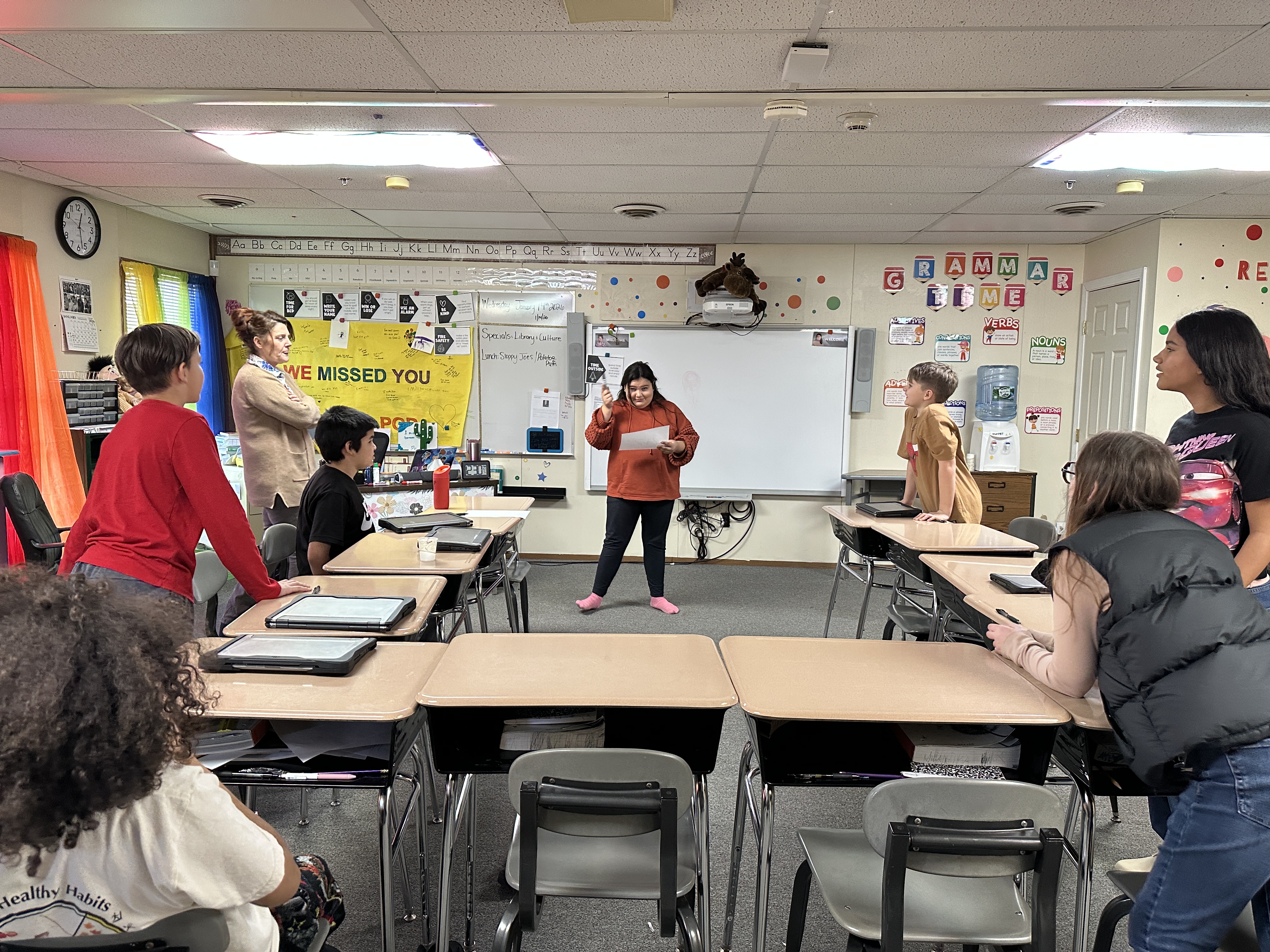 Students play a charades game focused on identifying emotions as part of their “I-Time” BARR activities. As one student acts out a feeling, others work together to interpret it.