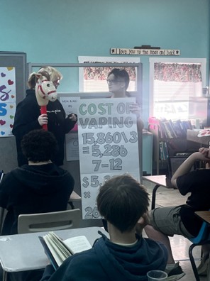 Students from Presque Isle High School’s Pathways Program participate in a lesson on the cost of vaping.