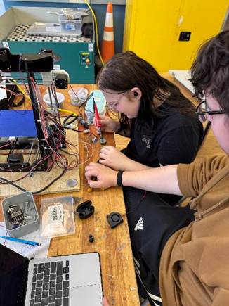 students working with 3D printer