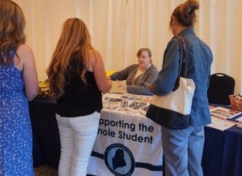 Physical Education Specialist Carolyn Gross at the Resource Fair engaging with attendees