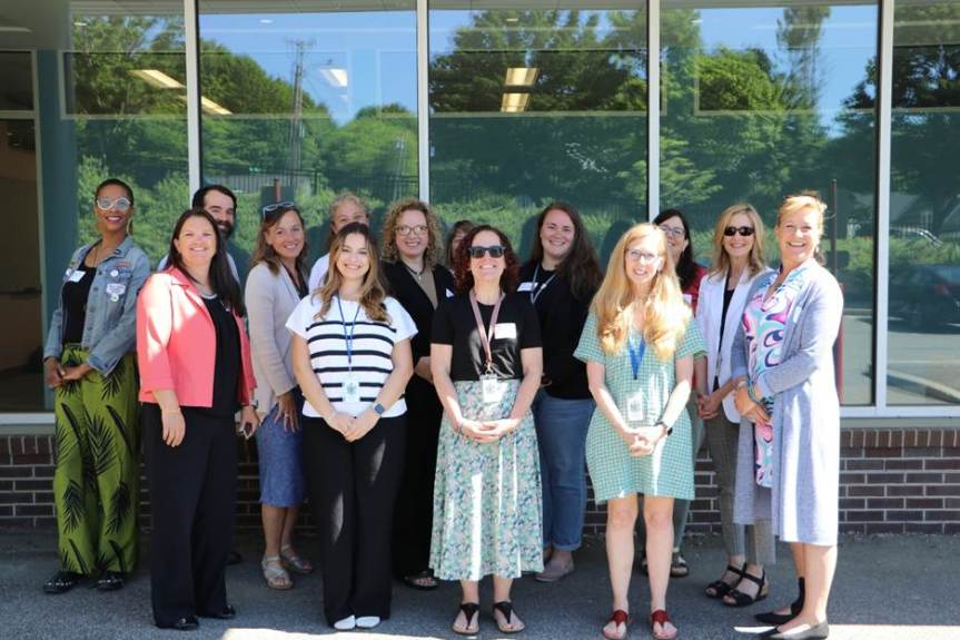 Back left to right - Ayesha Hall, Bryan Lescord, Julie Smyth, Marcy Whitcomb, Courtney Angelosante, Sue Gallant, Alexandra Cookson, Monique Sullivan, and Tamara Ranger. Front left to right - Shelley Chasse-Johndro, Intern Piper Hallen, Jennifer Belanger, Ann Hanna, and Sarah Nelson (arriving after the photo - Jess Anderson)
