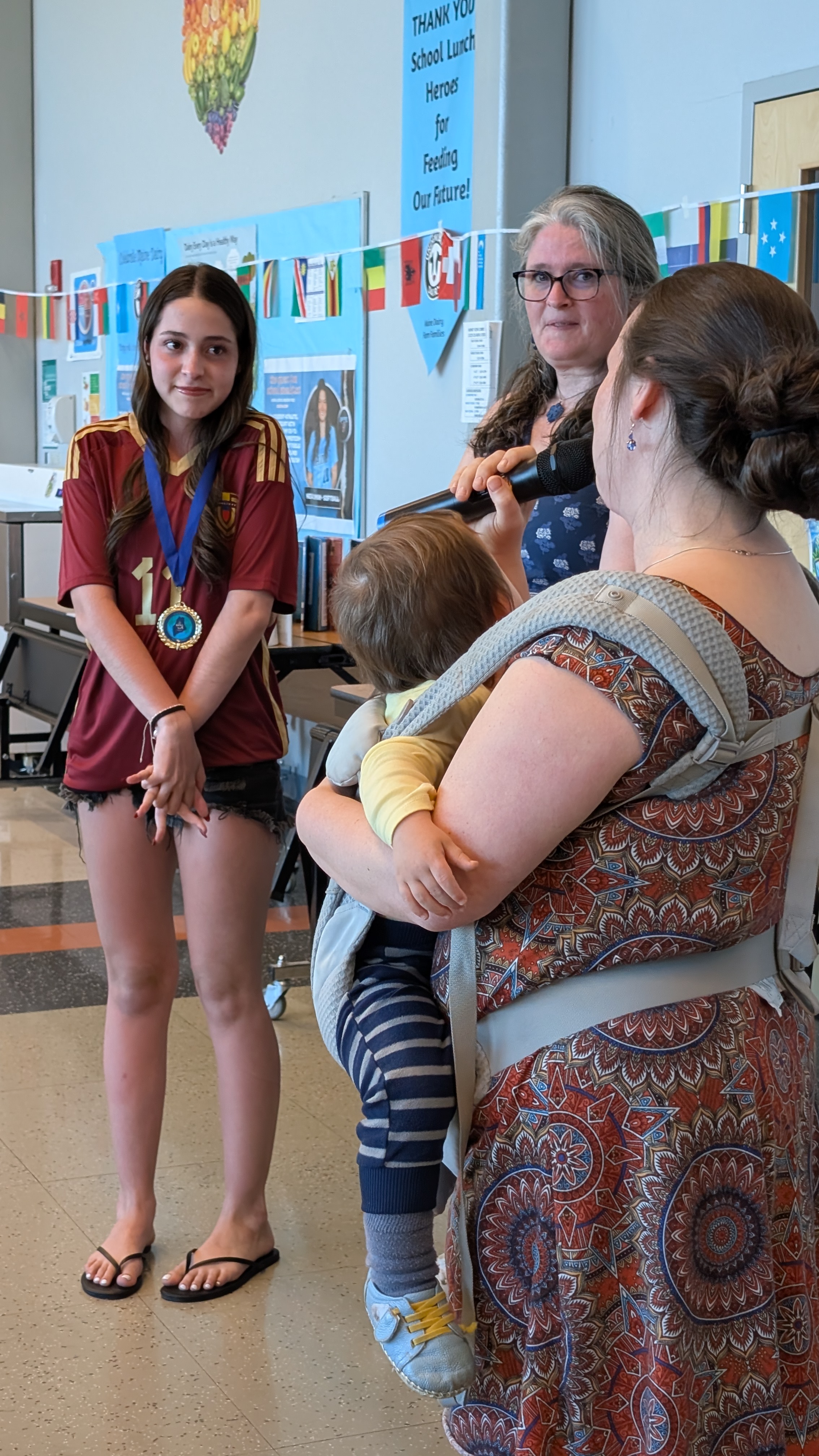 A graduating senior receives appreciation and encouragement during the Seal of Biliteracy Awards Ceremony at the Language and Culture Celebration.