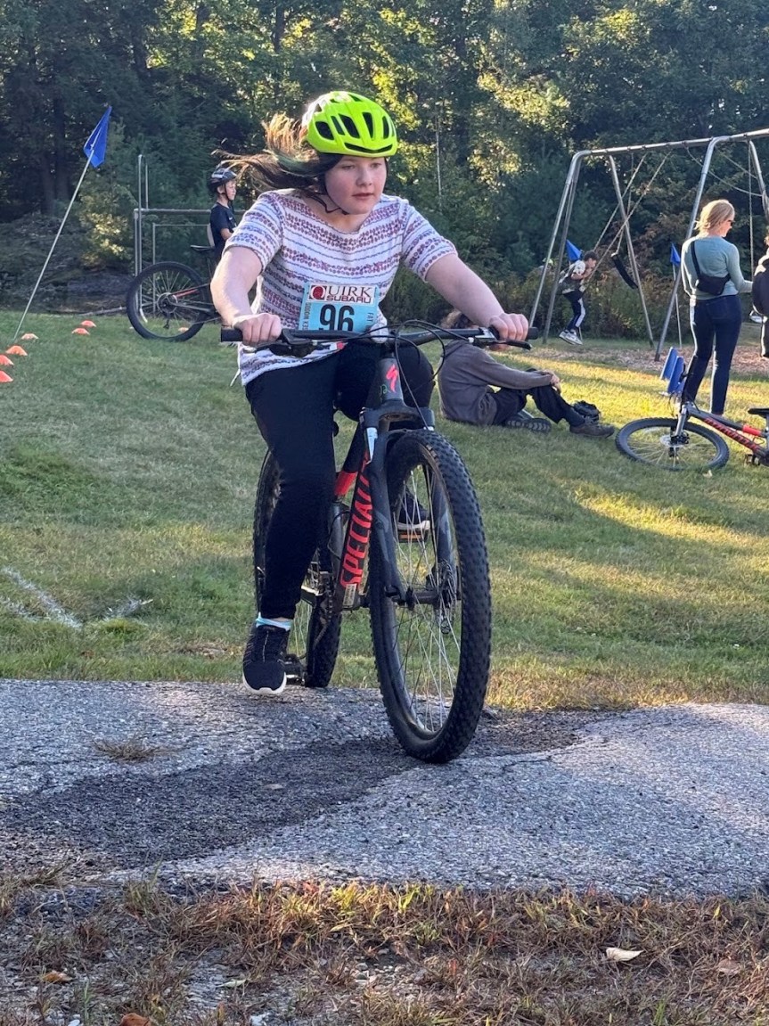 Student on bike.