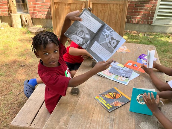 Young students doing activities outside.