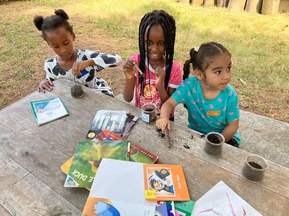 Young students doing activities outside.