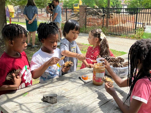 Young students doing activities outside.